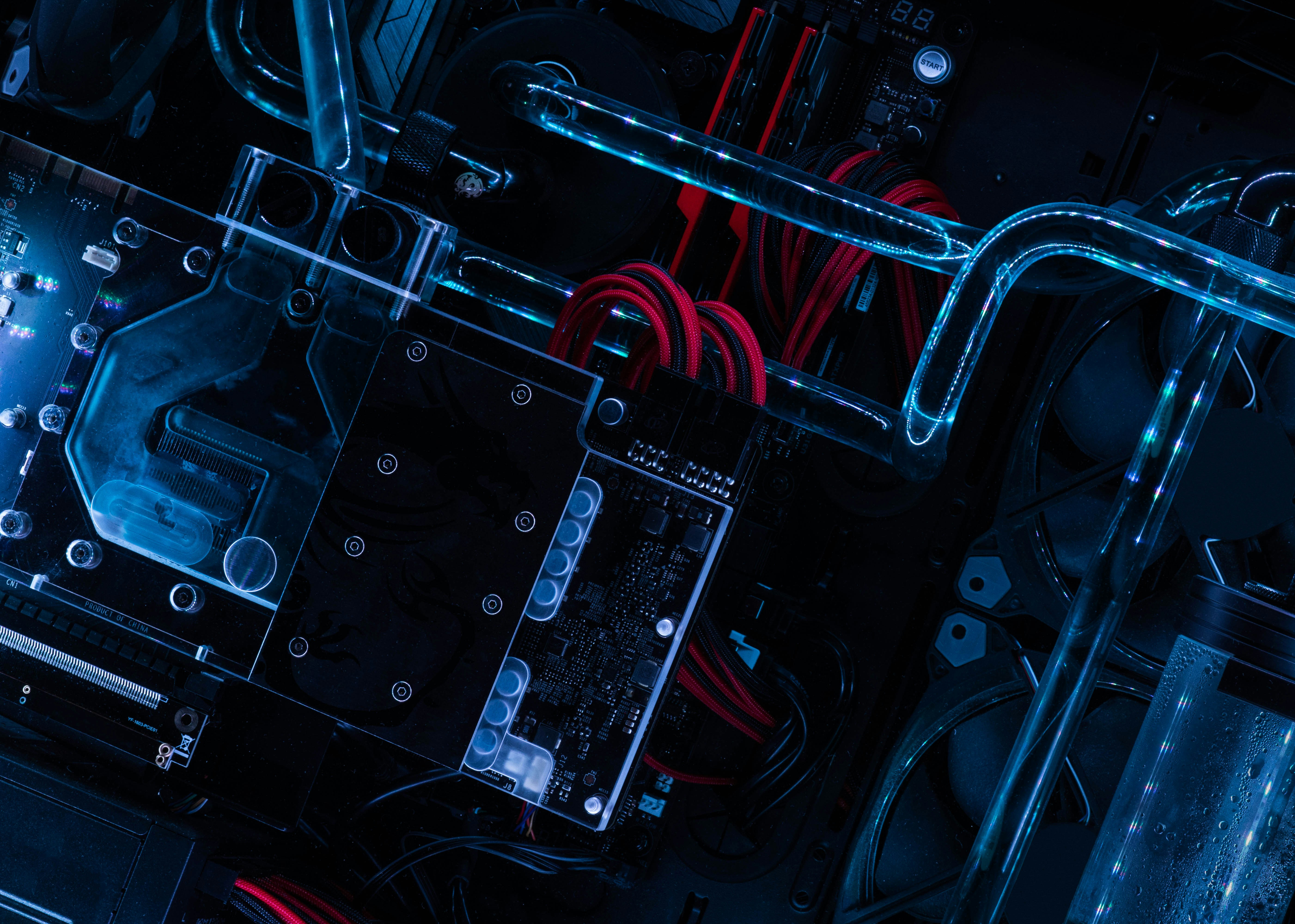 Custom-built computer with illuminated cooling tubes and magnetic components